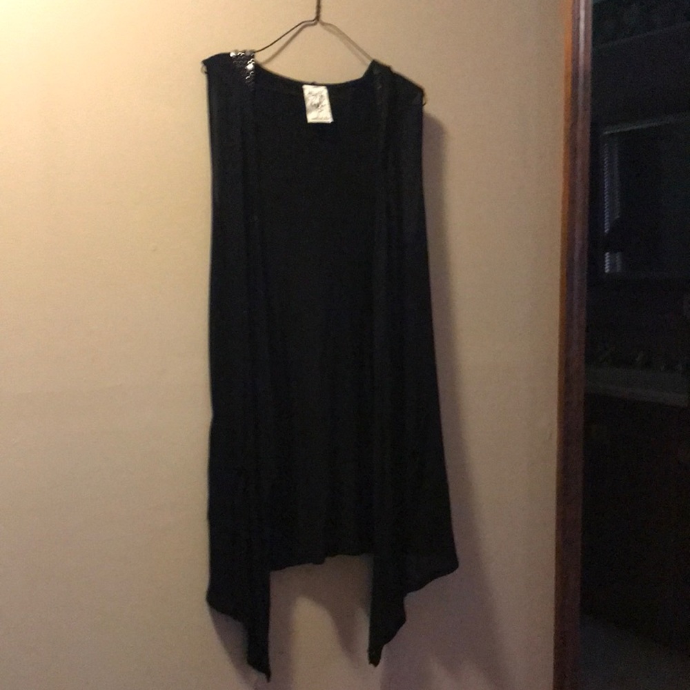Black rayon side tail vest with silver beaded trim on hooded collar
